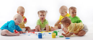 Group of babies painting on white background